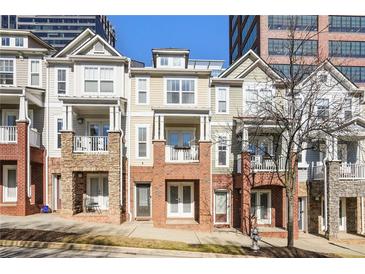 Charming multi-level townhomes featuring brick and siding exteriors and private balconies at 209 16Th Nw St # 6, Atlanta, GA 30363