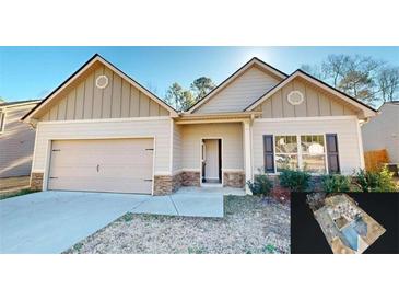 Ranch style home with two-car garage and stone accents at 148 Sourwood Ln, Temple, GA 30179