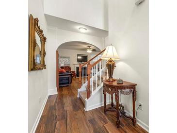 Bright entryway with hardwood floors, leading to living room and staircase at 1503 Dolcetto Nw Trce # 2, Kennesaw, GA 30152