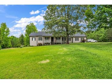 Ranch home with large yard and wrap around porch at 8926 East Carroll Rd, Winston, GA 30187