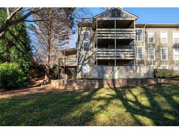 Multi-level condo building with private deck and wooded views at 1110 Riverview Se Dr, Marietta, GA 30067