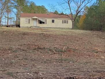 Ranch-style house with a yard, needs some TLC at 219 Hosannah Rd, Locust Grove, GA 30248