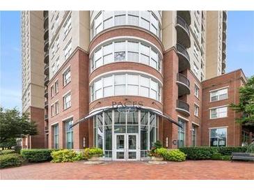 Brick building with glass entryway and landscaping at 325 E Paces Ferry Ne Rd # 806, Atlanta, GA 30305