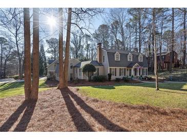 Charming two-story home with a spacious yard and mature trees at 315 Brandenburgh Cir, Roswell, GA 30075