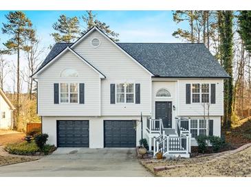 Two-story house with gray shutters, a two-car garage, and a deck at 2713 Windsor Nw Ct, Kennesaw, GA 30144