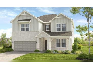 Two-story house with light gray siding, gray roof, and a two-car garage at 524 Nolden Trl, Dacula, GA 30019