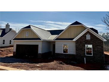 House exterior with stone and siding accents at 475 Charleston Pl, Villa Rica, GA 30180