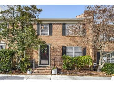 Attractive brick front exterior of a two-story home with landscaping at 868 E Ponce De Leon Ave, Decatur, GA 30030