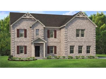 Two-story brick home with a large front yard and brown shutters at 121 Frontier Way, Mcdonough, GA 30253