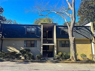 Attractive two-story condo building with dark roofing and landscaping at 28 Glenald Nw Way, Atlanta, GA 30327