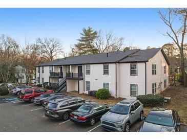 Two-story building with ample parking and mature trees at 3599 Woodbriar Cir # G, Tucker, GA 30084