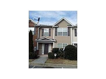 Two-story townhome with neutral siding and landscaping at 2962 Vining Ridge Ln, Decatur, GA 30034
