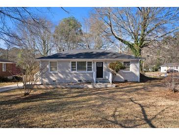 Charming ranch home with freshly painted brick and a spacious yard at 1761 Derrill Dr, Decatur, GA 30032