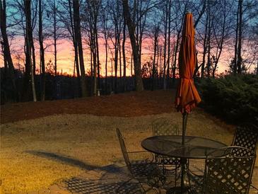 Relaxing patio with seating area and sunset view at 1805 Aurelia Dr, Cumming, GA 30041