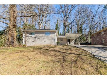 Ranch style home with carport and landscaped yard at 2884 Santa Monica Dr, Decatur, GA 30032