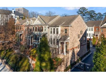 Brick front exterior of a charming townhome with gated entry at 3276 Ferncliff Ln, Atlanta, GA 30324