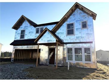Unfinished two-story home with windows installed and weather barrier, ready for siding and exterior details at 123 Cherry Glen Way, Euharlee, GA 30145