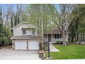 Charming two-story home featuring a two-car garage and inviting front porch at 2808 Mountbery Dr, Snellville, GA 30039