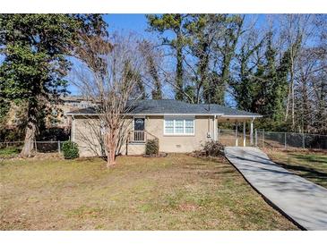 Ranch style home with driveway and landscaped yard at 2182 Loring Ct, Decatur, GA 30032