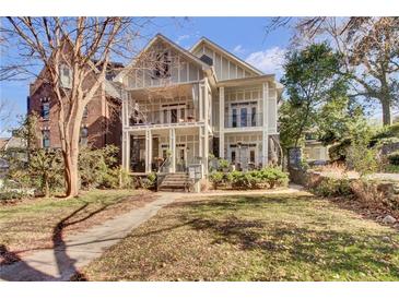 Two-story house with front yard, walkway, and balcony at 935 Piedmont Ave # 201, Atlanta, GA 30309