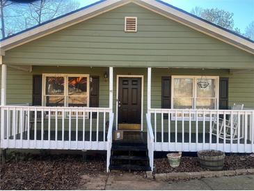 Ranch home with front porch and rocking chairs at 1638 River Trce, Auburn, GA 30011