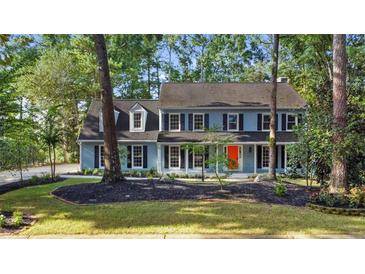 Two-story house with blue siding, white trim, and a red door at 2421 Edge Hill Dr, Snellville, GA 30078