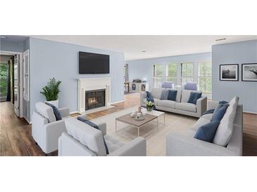 Spacious living room with hardwood floors and fireplace at 24214 Plantation Ne Dr, Atlanta, GA 30324