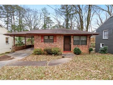 Brick ranch house with carport and mature trees at 2425 Hillside Ave, Decatur, GA 30032