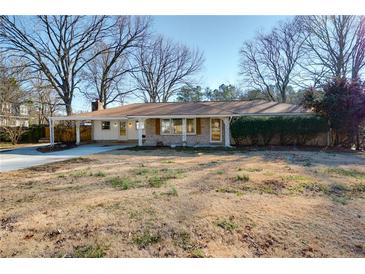 Ranch style home with mature trees and a spacious yard at 2833 Alan Sw Dr, Marietta, GA 30064