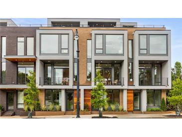 Modern townhome community with multiple units, showcasing sleek design and landscaping at 105 Georgia Se Ave # 1, Atlanta, GA 30312