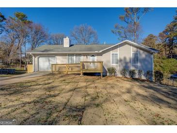 Ranch style home with attached garage and deck at 912 Northridge Nw Dr, Conyers, GA 30012