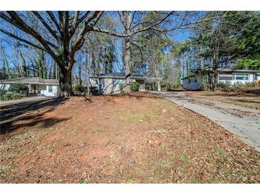 Ranch home with driveway and mature trees at 3388 Jackson Dr, Decatur, GA 30032