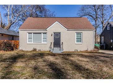 Charming brick ranch home with a well-maintained lawn at 2446 Lynn Iris Dr, Decatur, GA 30032