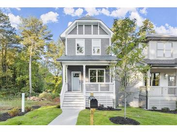Charming craftsman style home with gray siding, white trim, and a welcoming front porch at 1697 Thomas St, Decatur, GA 30032