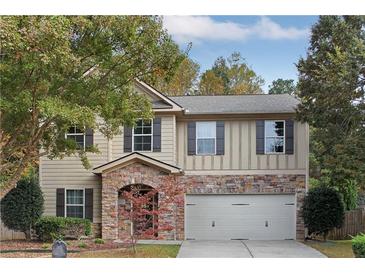 Two story house with stone accents and a two car garage at 3945 Silverthorn Trce, Cumming, GA 30028