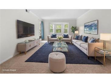 Spacious living room featuring ample natural light and stylish furnishings at 6851 Roswell Rd # I29, Atlanta, GA 30328