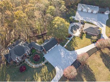 Aerial view of house, detached garage, and expansive grounds at 686 Newton Factory Bridge Rd, Covington, GA 30014