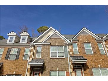 Brick townhouse exterior with dormers and shutters at 2372 Johnson Rd, Atlanta, GA 30345