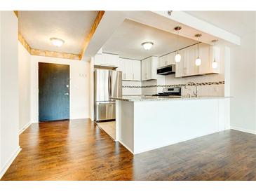 Modern kitchen featuring stainless steel appliances and granite countertops at 620 Peachtree Ne St # 415, Atlanta, GA 30308