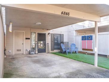 Covered parking with private entrance and small turf yard at 4846 Twin Lakes Trl, Atlanta, GA 30360