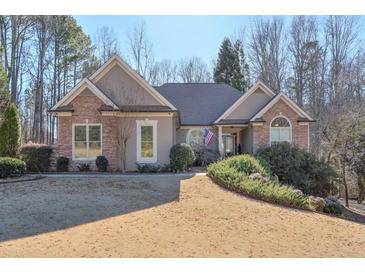 Beautiful two-story home with stone accents and landscaped yard at 531 Sweetfern Ln, Sugar Hill, GA 30518