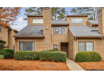 Attractive 2-story townhome with landscaping and walkway at 1801 Parkaire Xing, Marietta, GA 30068