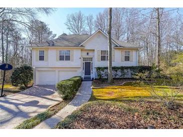 Two-story house with attached garage and manicured lawn at 5955 Shannon Dr, Cumming, GA 30040