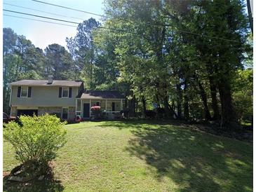 Ranch style home with attached garage and spacious yard at 3809 Chimney Ridge Ct, Ellenwood, GA 30294
