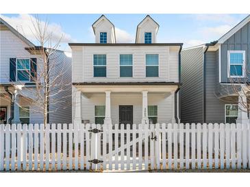 Two-story home with white siding and a charming front porch at 3065 Windover Ln, Kennesaw, GA 30144