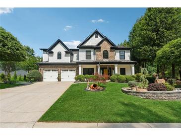 Stunning two-story home with a three-car garage and landscaped yard at 7108 Roselake Cir, Douglasville, GA 30134