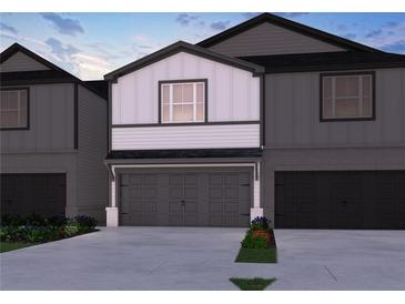 Charming two-story home with a spacious two-car garage and attractive exterior at 2115 Avalon Rdg, Conyers, GA 30013