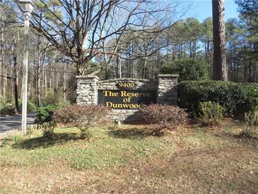 Stone sign for The Reserve of Dunwood community at 9400 Roberts Dr # 1C, Atlanta, GA 30350