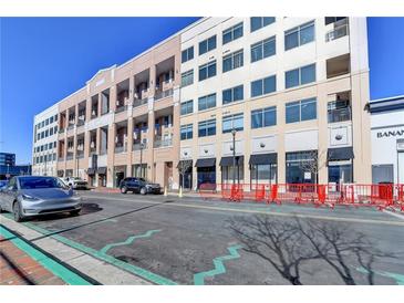 Modern building exterior with street-level retail and residential units above at 260 18Th Nw St # 10203, Atlanta, GA 30363