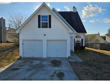 Two-car garage and neat front yard at 2718 High Tide Dr, South Fulton, GA 30349